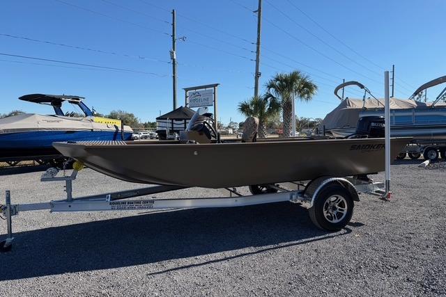 2026 Smoker Craft Pro Sportsman 1660 boat on trailer in outdoor lot.