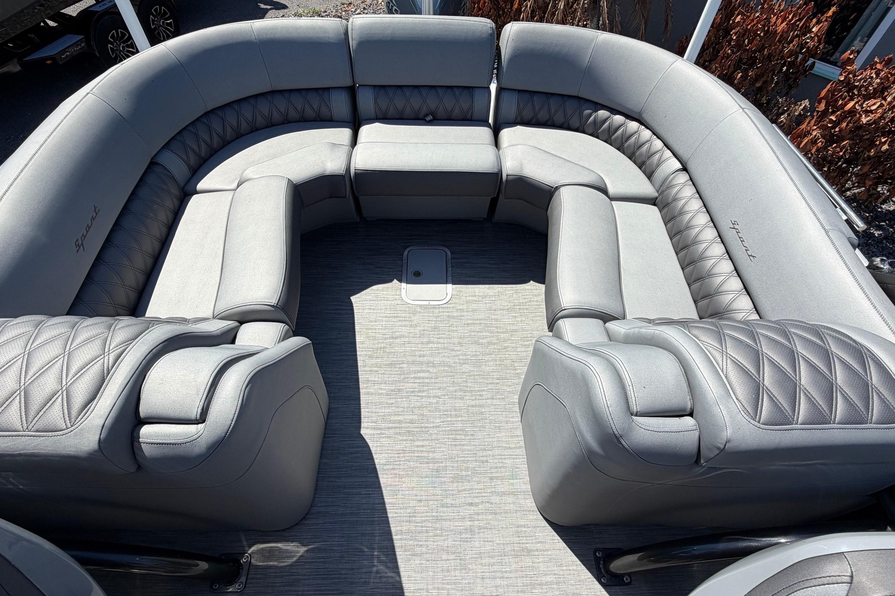 Luxurious seating on 2022 Bennington 25 QX pontoon boat with quilted upholstery.