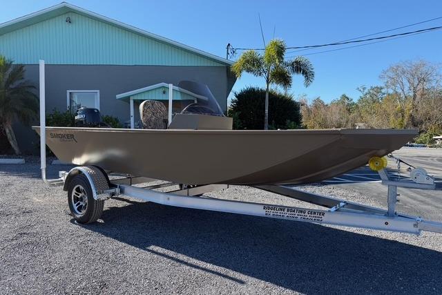 2026 Smoker Craft Pro Sportsman 1660 boat on trailer, parked outdoors.