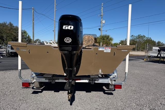 2026 Smoker Craft Pro Sportsman 1660 boat with 60 HP motor on trailer.
