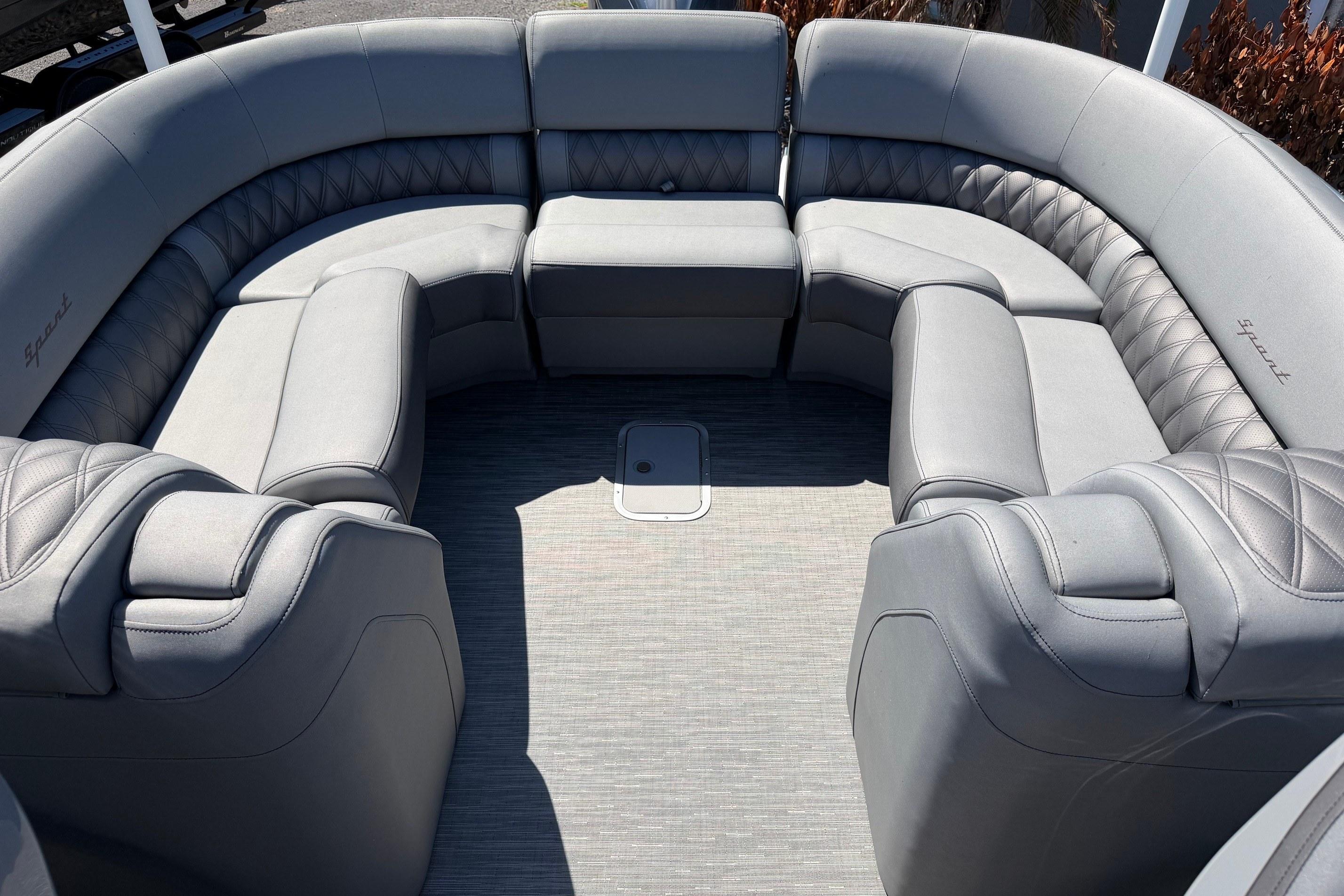 Luxurious seating on 2022 Bennington 25 QX boat, featuring elegant gray upholstery.