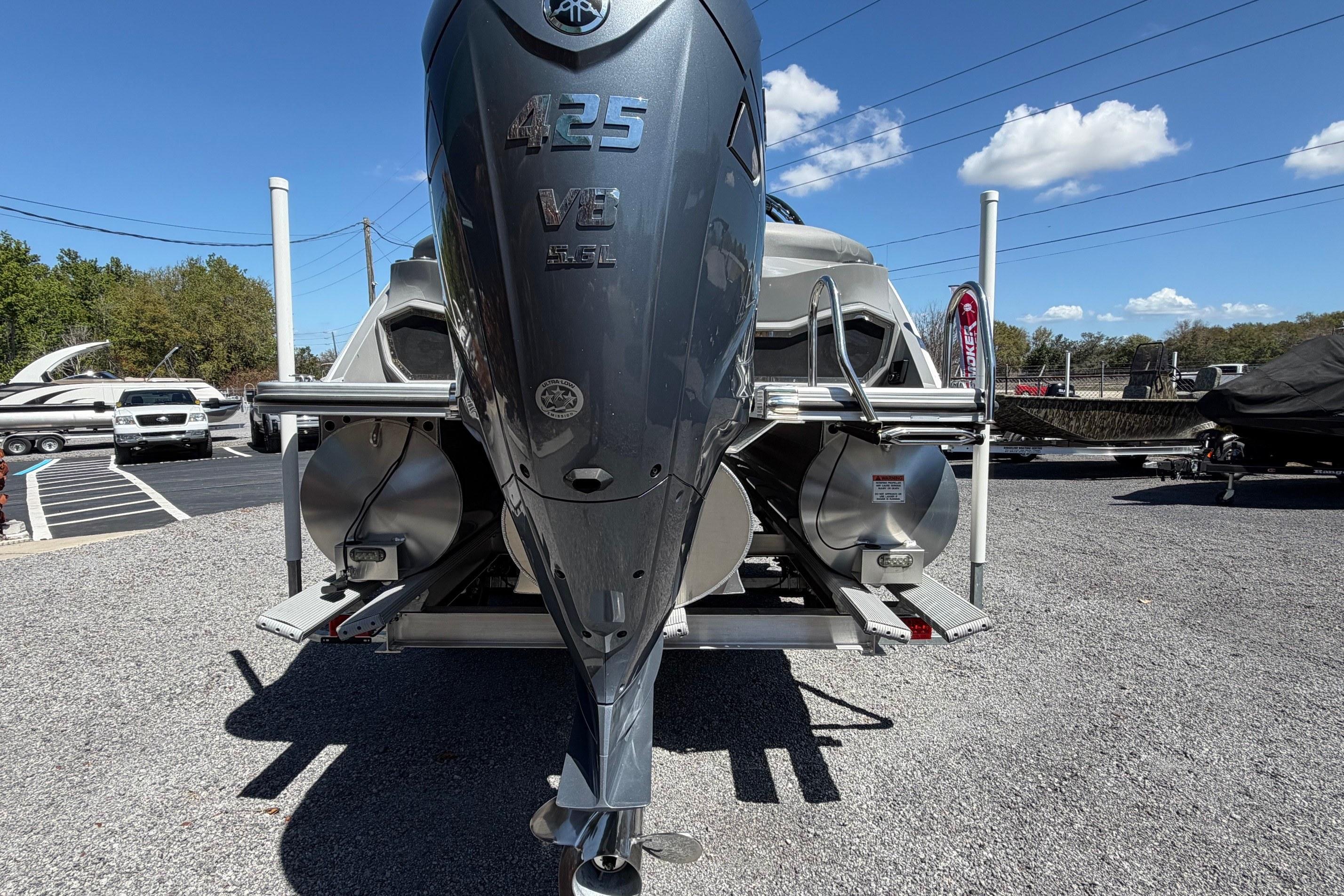2022 Bennington 25 QX boat with powerful 425 V8 engine displayed outdoors.