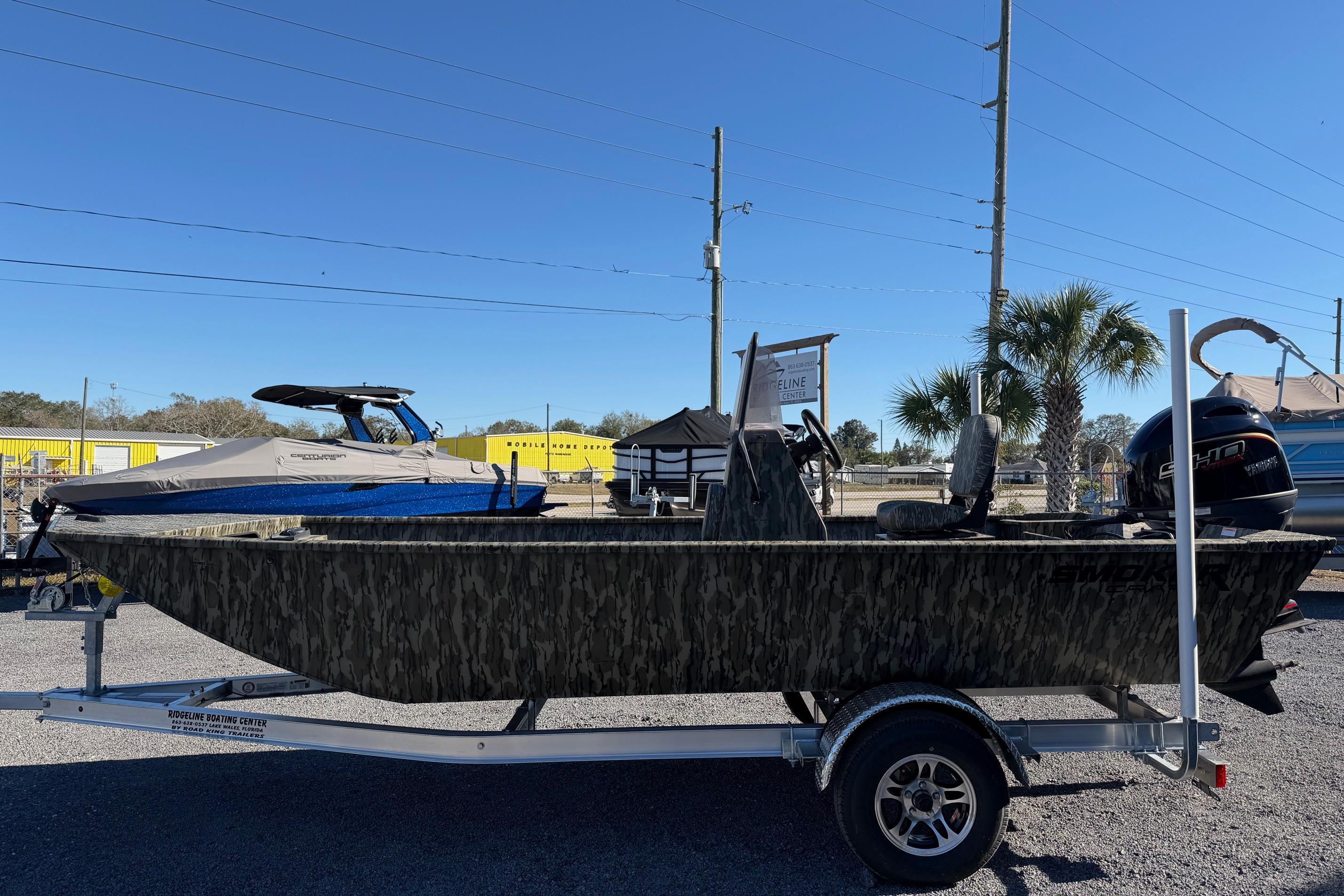 2026 Smoker Craft Sportsman 1866 boat on trailer, camo design, outdoor display.